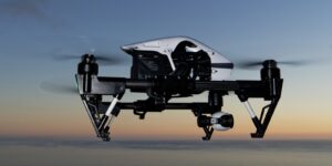 Drone in flight against a sunset sky, symbolizing innovation in technology and automation.