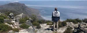 Global leader overlooking a vast African landscape, representing cultural intelligence and global strategy.